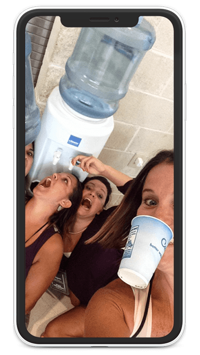 Team using the Eventzee Scavenger Hunt App completes a task to get a drink of water from a water station